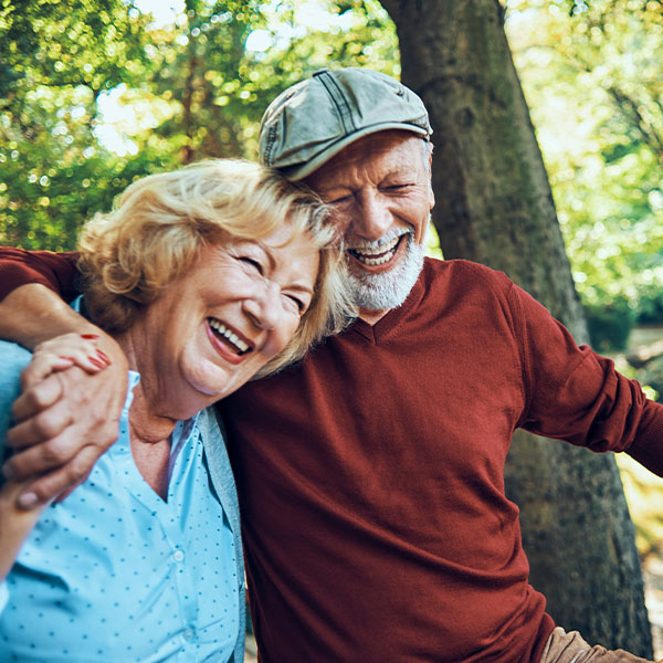 Happy couple smiling outdoors