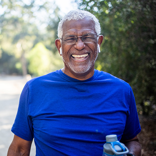 Happy man running outside