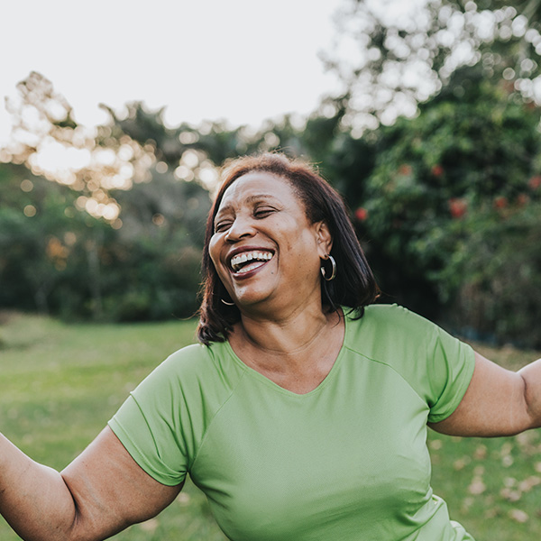Happy woman smiling outdoors