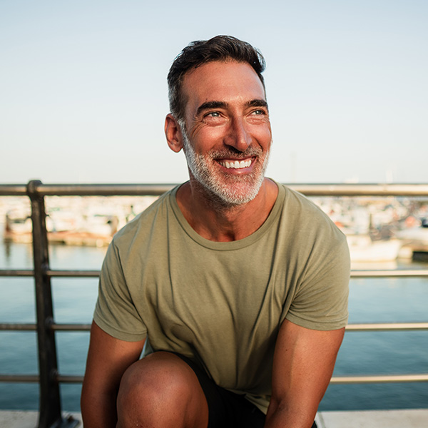 Happy man smiling outdoors