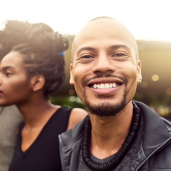 Happy man smiling outdoors